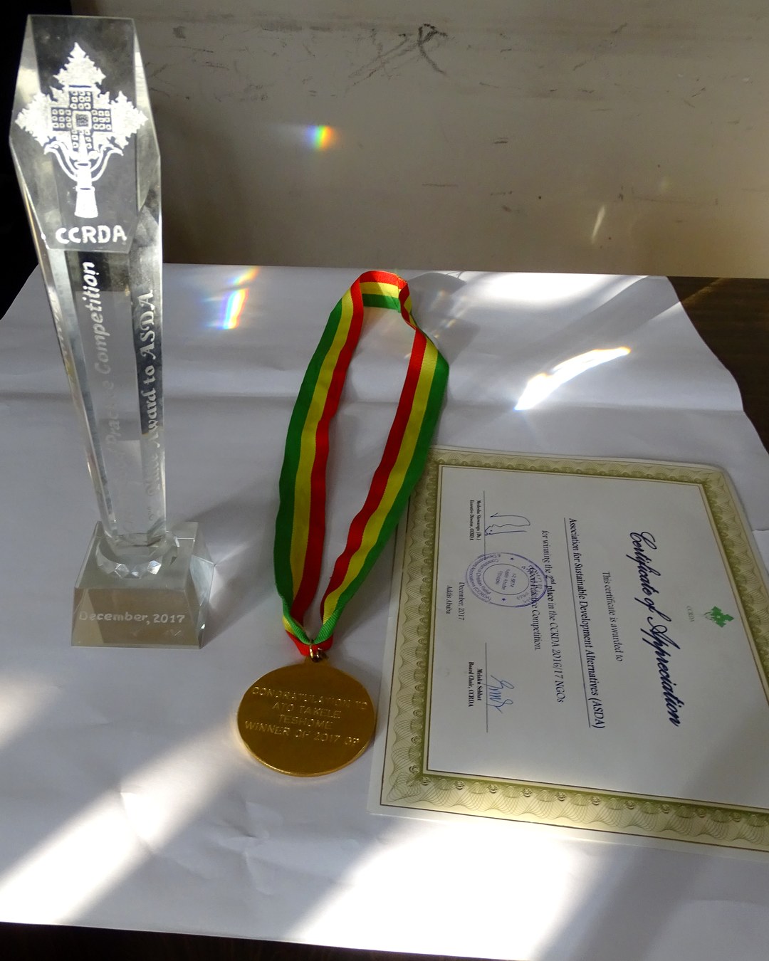 The CCRDA trophy, medal and certificate of appreciation awarded to ASDA in December 2017