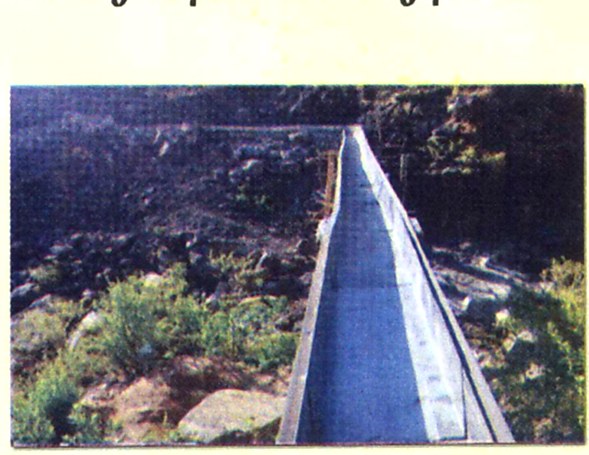 A lined canal carrying water to a small-scale irrigation scheme